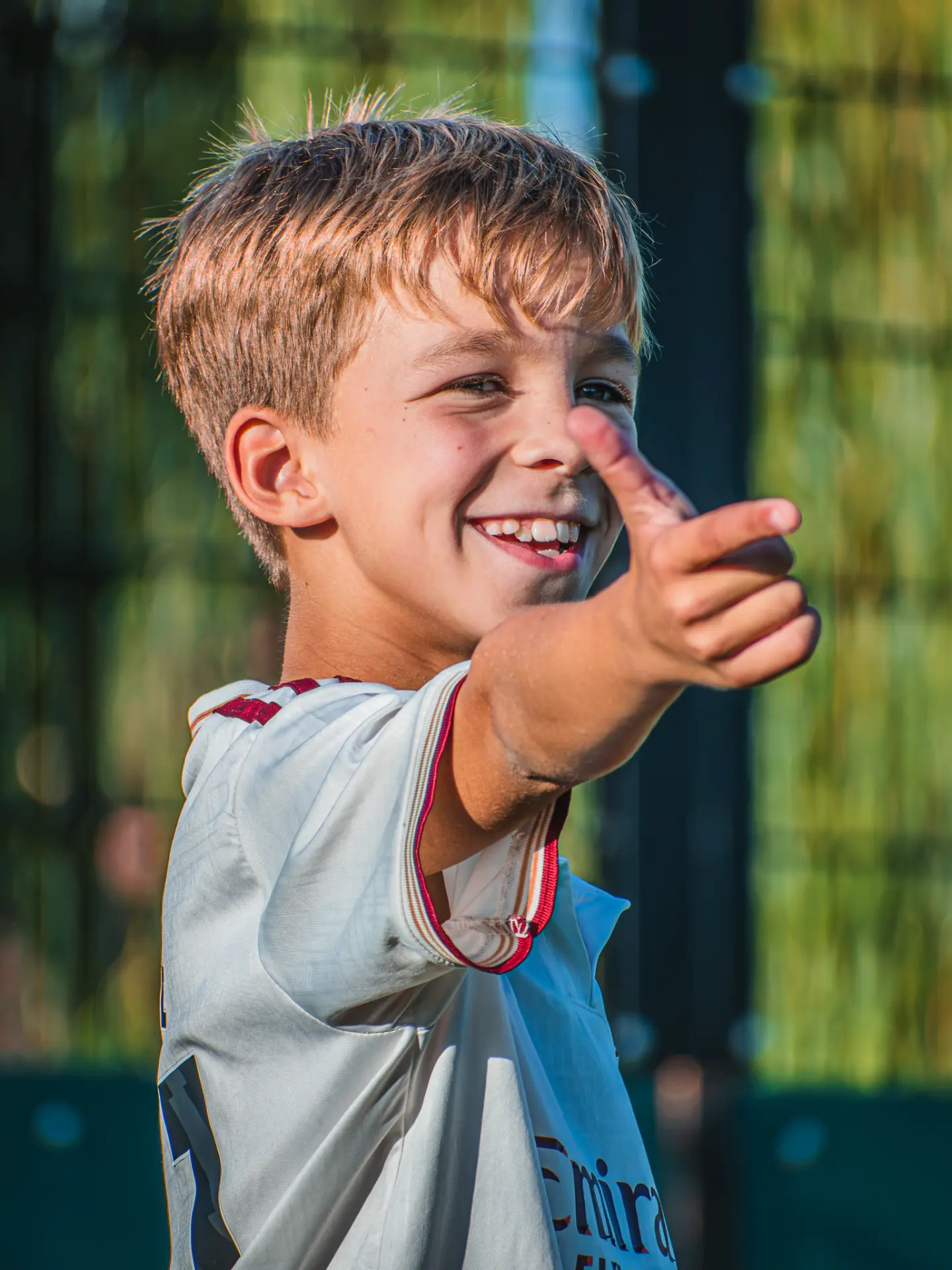 Smiling young player giving a thumbs up