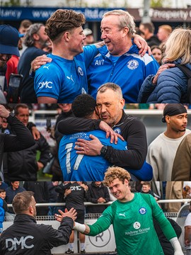 Players and staff embracing on the pitch after a match